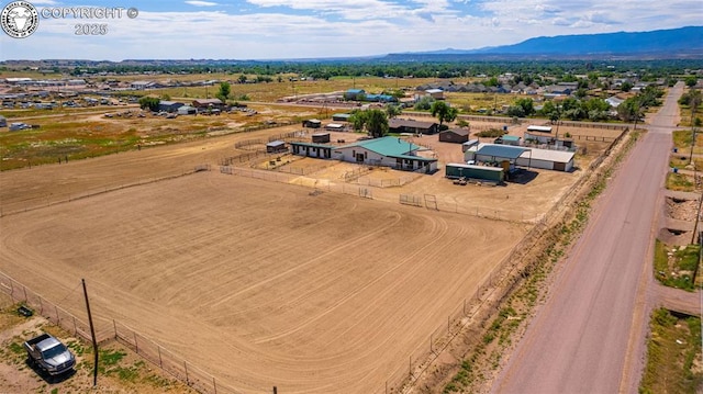 birds eye view of property with a mountain view