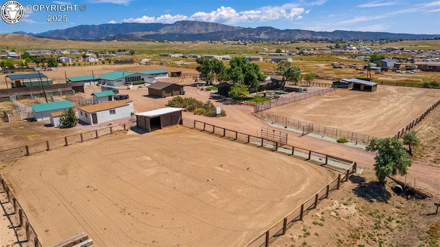 birds eye view of property with a mountain view