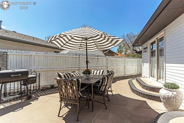 717 Tyrolean Way, Canon City, CO 81212 - view of patio / terrace with outdoor dining area and a fenced backyard