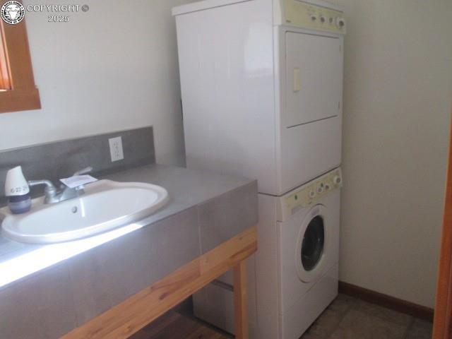 474 Black Fawn Ln, Westcliffe, CO 81252 - washroom featuring estacked washer and dryer