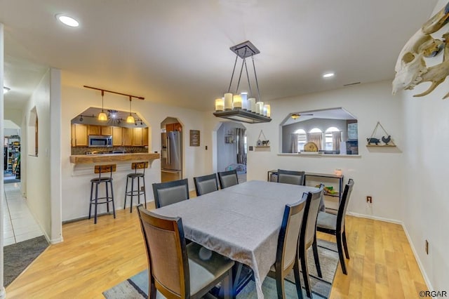 dining space featuring light hardwood / wood-style floors