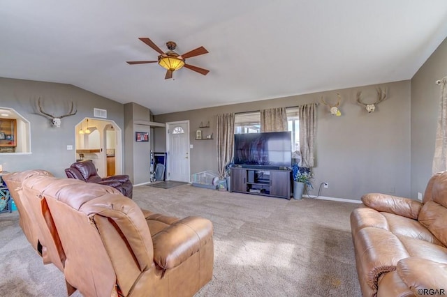 carpeted living room with lofted ceiling and ceiling fan