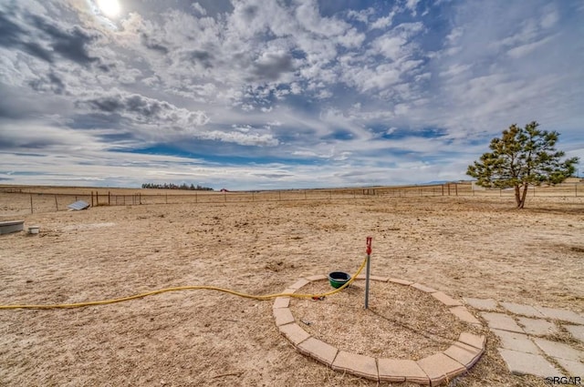 view of yard with a rural view