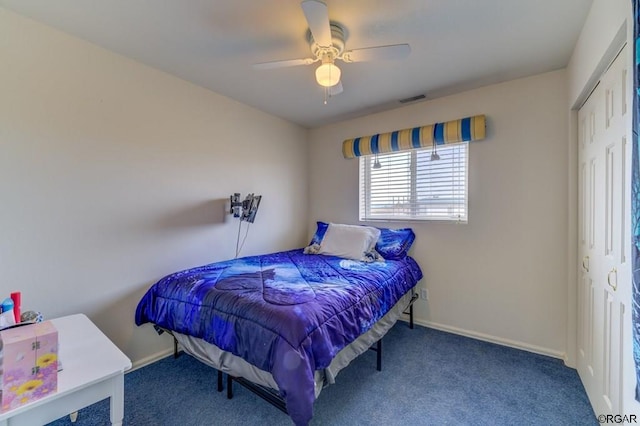 bedroom featuring carpet, ceiling fan, and a closet