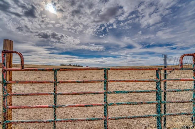 view of gate featuring a rural view