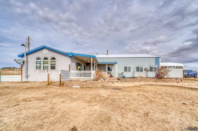 view of front of property featuring a sunroom