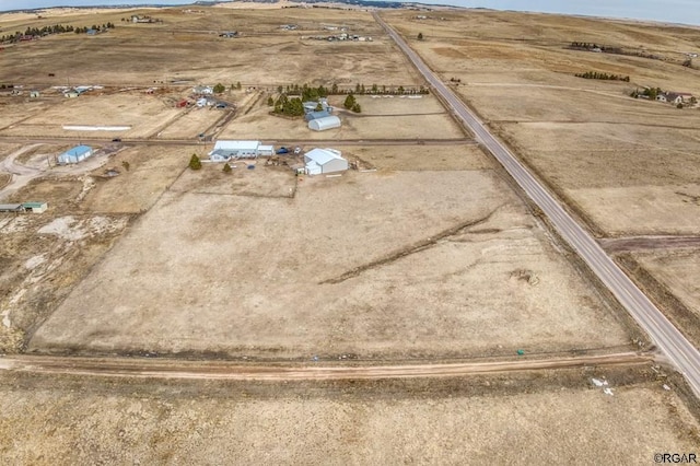 birds eye view of property featuring a rural view