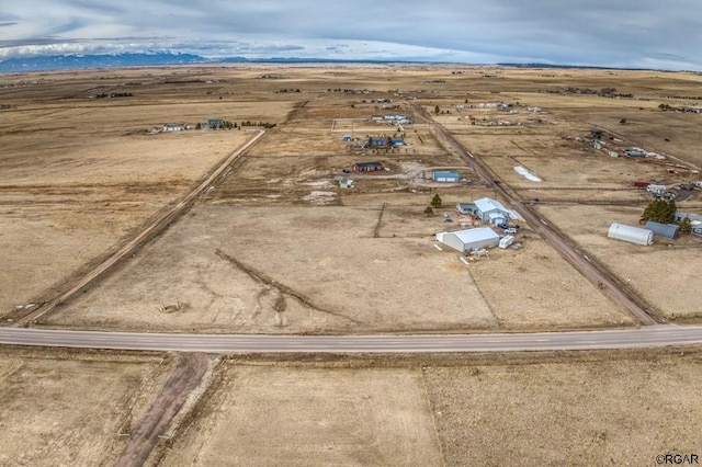 birds eye view of property featuring a rural view