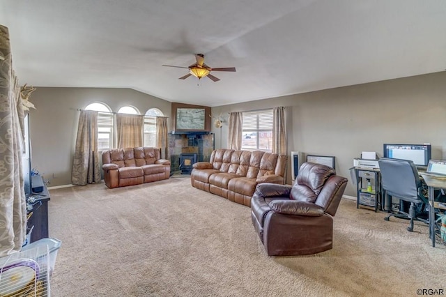 living room with lofted ceiling, ceiling fan, and carpet