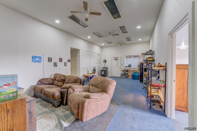 carpeted living room with ceiling fan