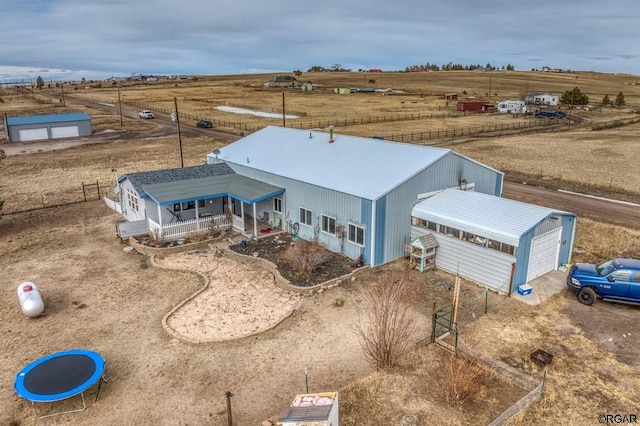 birds eye view of property featuring a rural view