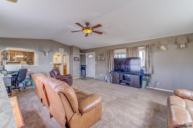 living room with vaulted ceiling, light colored carpet, and ceiling fan