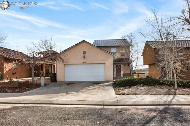 view of front of property featuring a garage