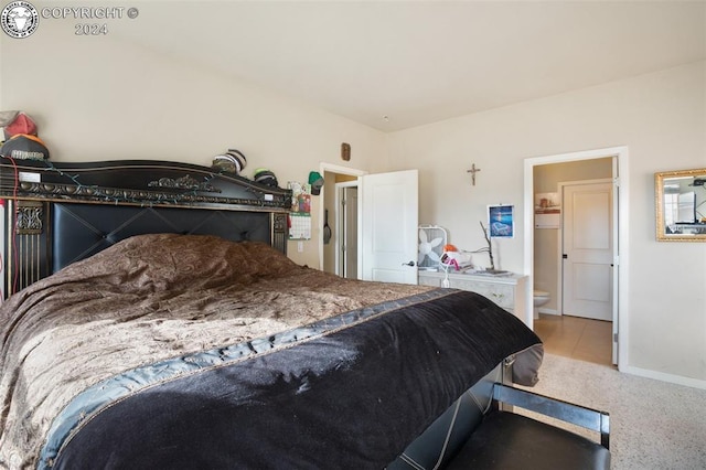 bedroom with carpet and ensuite bathroom