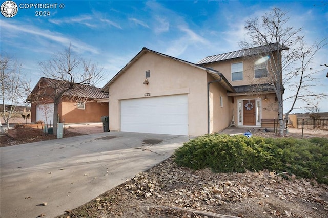 view of front of property with a garage