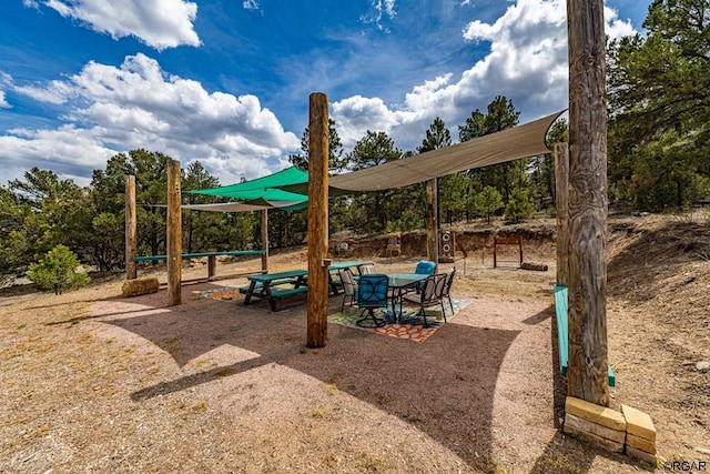 view of play area with a patio