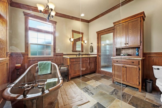 interior space featuring hanging light fixtures, ornamental molding, sink, and a notable chandelier