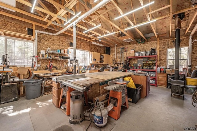 misc room featuring concrete flooring and a workshop area