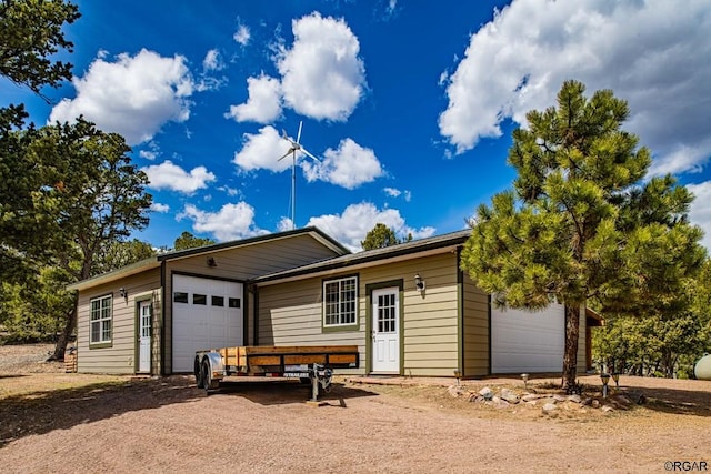 ranch-style home featuring a garage