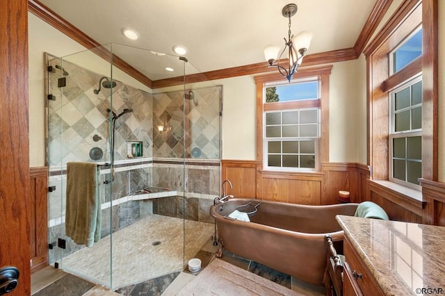 bathroom featuring vanity, crown molding, and independent shower and bath