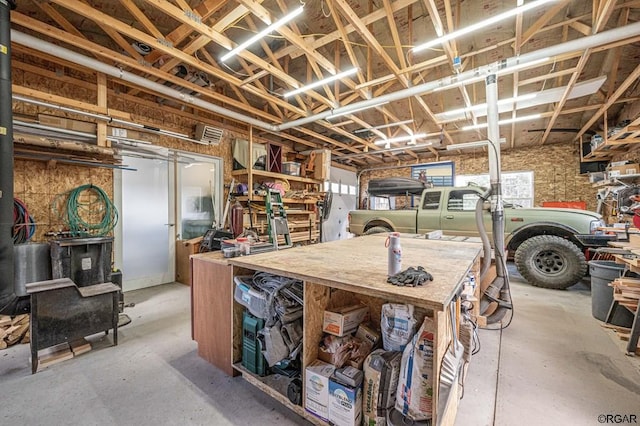 basement with a workshop area and a wealth of natural light