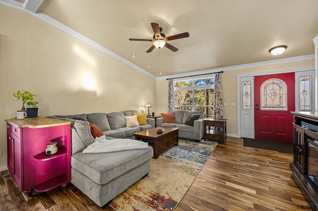 living room featuring hardwood / wood-style floors, ornamental molding, and ceiling fan