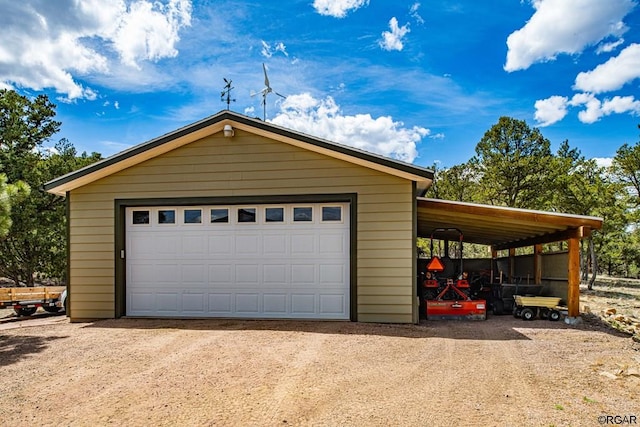 garage featuring a carport