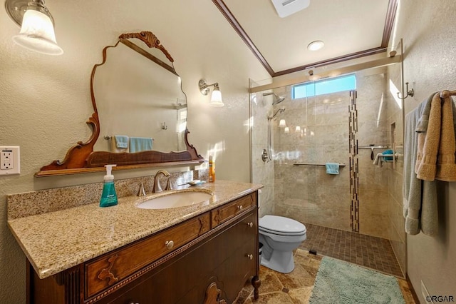 bathroom with walk in shower, ornamental molding, toilet, and vanity