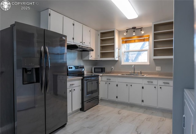 kitchen with white cabinetry, appliances with stainless steel finishes, washer / dryer, and sink