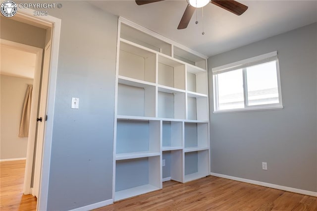 unfurnished bedroom featuring hardwood / wood-style flooring and ceiling fan