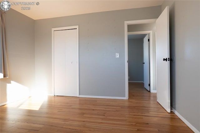 unfurnished bedroom featuring hardwood / wood-style floors