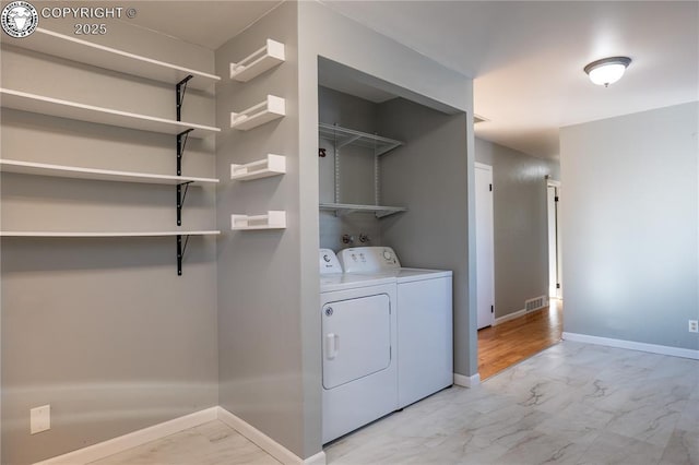 laundry area with washer and clothes dryer