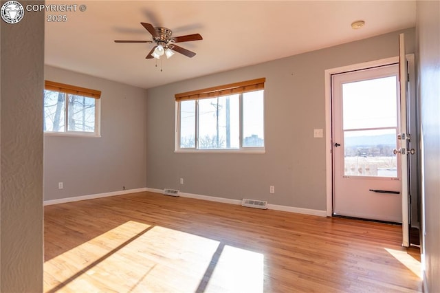 unfurnished room featuring ceiling fan and light hardwood / wood-style flooring