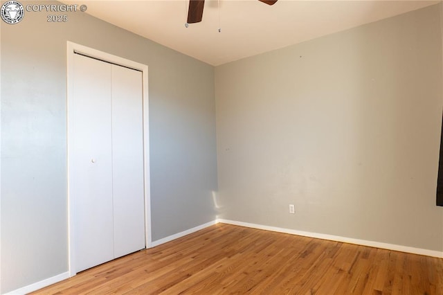 unfurnished bedroom featuring a closet, ceiling fan, and light hardwood / wood-style flooring