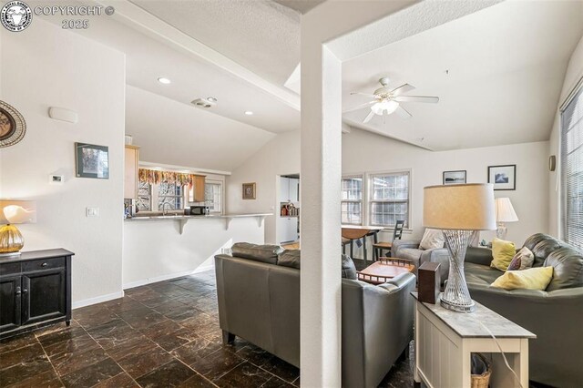 living room with lofted ceiling and ceiling fan