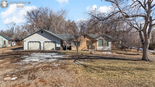 ranch-style home with a garage and a front yard