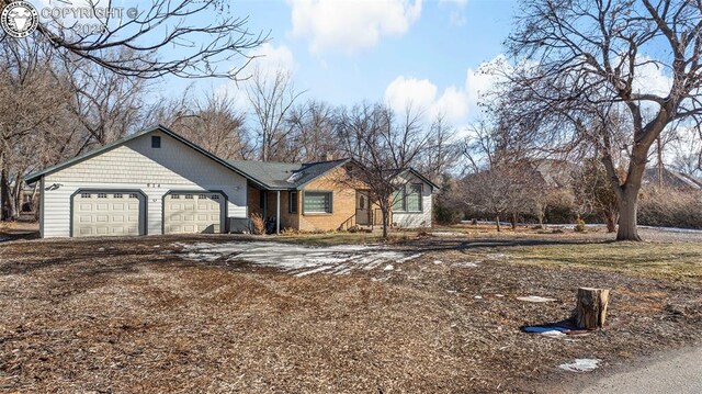 ranch-style house featuring a garage