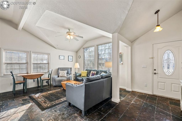 living room with ceiling fan, lofted ceiling with beams, and a textured ceiling