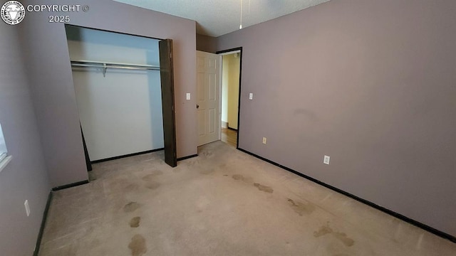 305 Meadowlark Cir, Florence, CO 81226 - unfurnished bedroom with light carpet, baseboards, and a closet