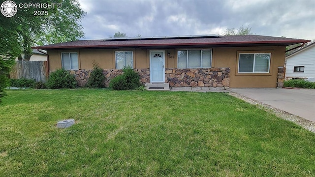 305 Meadowlark Cir, Florence, CO 81226 - ranch-style home featuring stone siding, stucco siding, and roof mounted solar panels