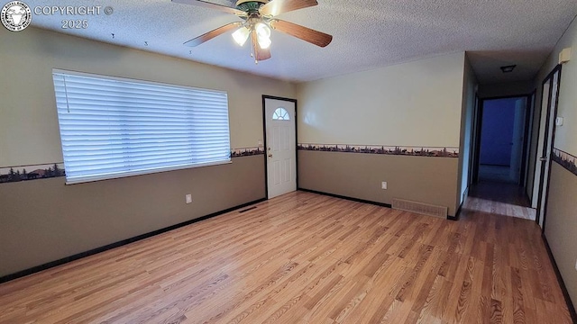 305 Meadowlark Cir, Florence, CO 81226 - spare room featuring wood finished floors, a textured ceiling, and ceiling fan