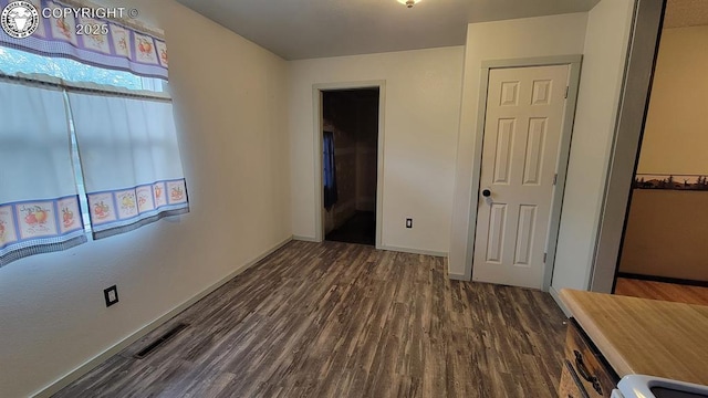 305 Meadowlark Cir, Florence, CO 81226 - unfurnished bedroom with dark wood finished floors and baseboards