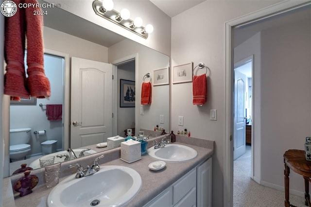 bathroom with vanity and toilet