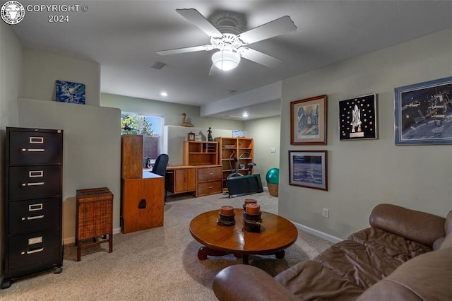 carpeted living room featuring ceiling fan