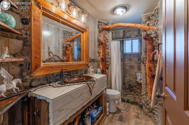 38 Macdonnell Dr, Cotopaxi, CO 81223 - full bathroom with vanity, wood finished floors, toilet, and tiled shower
