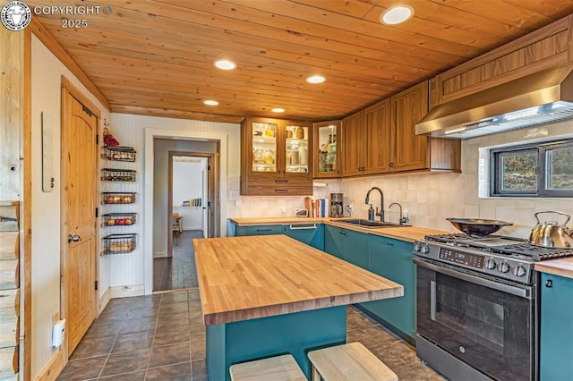 kitchen featuring a sink, wood counters, stainless steel range with gas cooktop, wall chimney range hood, and wood ceiling