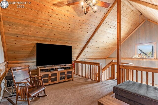 living area featuring carpet, lofted ceiling with beams, wooden walls, and a ceiling fan