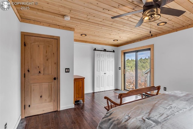 bedroom featuring baseboards, wood ceiling, a barn door, dark wood-style floors, and access to outside