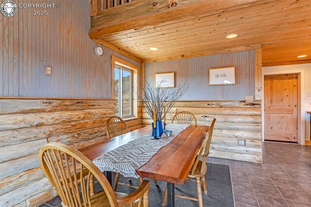 dining area with tile patterned floors, log walls, wood ceiling, and recessed lighting