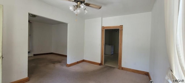 carpeted spare room with a baseboard radiator and ceiling fan